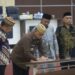 Bupati Ismet Mile didampingi Sekda Iwan Mustapa saat menghadiri Rapat Paripurna Pembicaraan Tingkat II APBD-P 2026 di DPRD Bone Bolango, Kamis (24/9/2026). (F.Onal/Prokopim)